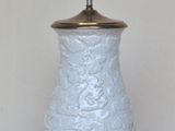 a lamp that is on a table with a white background