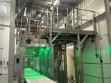 a conveyor belt in the middle of a factory with a conveyor belt in the middle of it