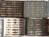 several different types of cigars are lined up on a bed