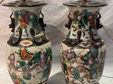two vases that are sitting on a table
