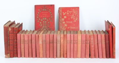 several old books are stacked on a shelf on a white surface