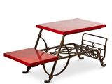 une image représentant une table rouge avec un banc en dessous