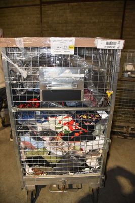 a metal cart with many items in it in a warehouse