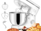 an image of a white mixer with a bowl and a bowl of doughnuts next to it