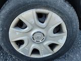 a white car that has a flat tire on it