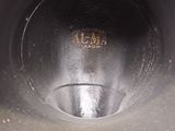 a close up view of a metal object with a hole in it