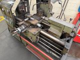 a machine that is sitting on the ground in front of a building