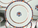 a lot of plates that are sitting on a table