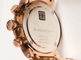 an image of a close up of a wrist watch on a white surface