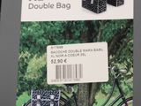 a black bicycle with a basket on the back of it