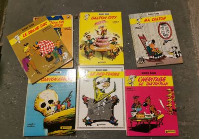 several children ' s books are lined up on a table
