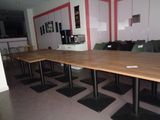 tables and chairs in a room with red walls and white walls