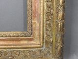 an image of a picture of a gold frame on a grey background