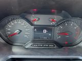 a close up of a car dashboard with a speedometer and gauges