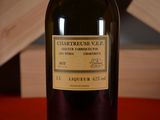 a bottle of wine that is sitting on a table
