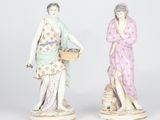 pair of porcelain figurines of women with baskets of flowers
