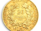a close up of a gold coin with a wreath on it