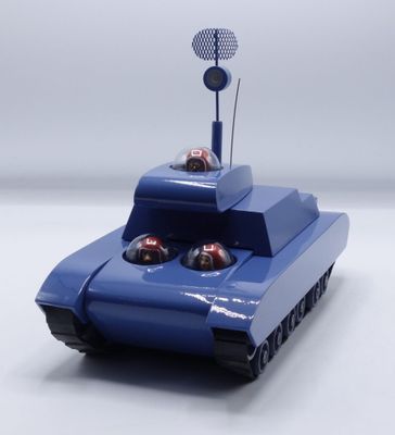a blue toy tank with a tennis racket on top