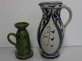 two vases sitting next to each other on a table