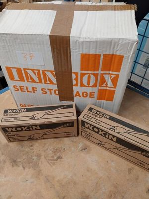 two boxes are stacked on top of each other on a table