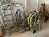 a lot of different types of hoses on the floor