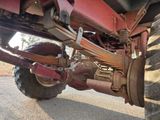 a tractor that is parked on the side of the road