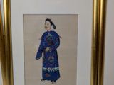 two framed pictures of a woman in a blue dress and a man in a blue robe