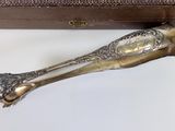 a silver spoon sitting next to a box on a table