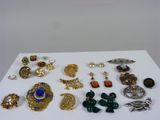 many different types of jewelry on a white surface
