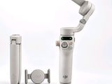 a white device that is sitting on top of a tripod