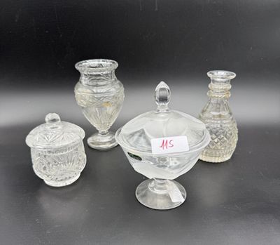 a group of glass vases and jars sitting on a table