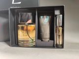 an image of a couple of bottles of perfume sitting in a box