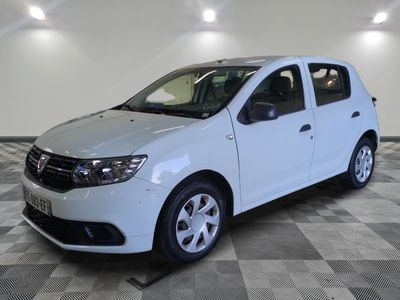 a picture of a white car parked on a checkered floor