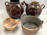 three brown vases sitting next to each other on a white surface