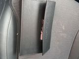the interior of a car with a phone holder in the center of it