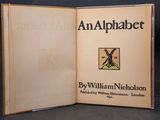 an alphabet book with a picture of a bird on the cover