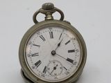 an antique pocket watch with roman numerals and roman numerals on the face