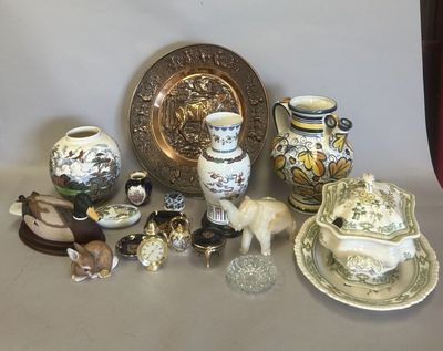 many different types of vases and plates on the table