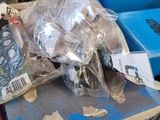 a pile of assorted items sitting on top of a pile of boxes