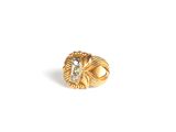 a close up of a gold ring on a white background