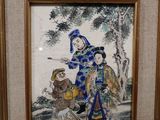 framed picture of a painting of a man and a woman with a child