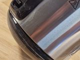 a close up of a toaster on a wooden table