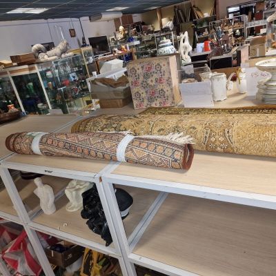 a long piece of art on a table in a store