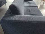 an image of a living room with a couch and chairs