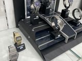 a lot of watches on display in a glass case