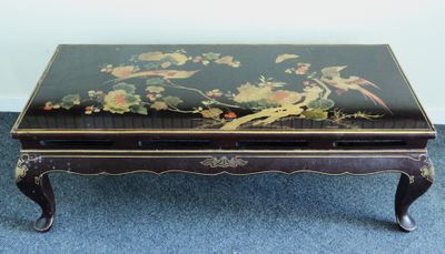 a black table with a bird design on it