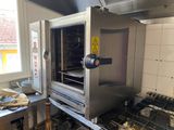 an oven that is sitting in the middle of a kitchen