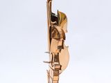 a bronze sculpture of a man playing a violin on a marble base