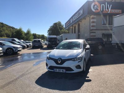 a white car parked in front of a building in a parking lot