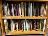 many books on the bookshelf in the library